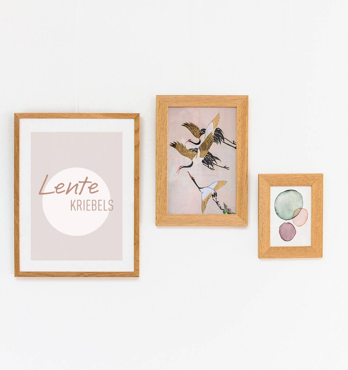 EN wooden frames on the wall with spring prints