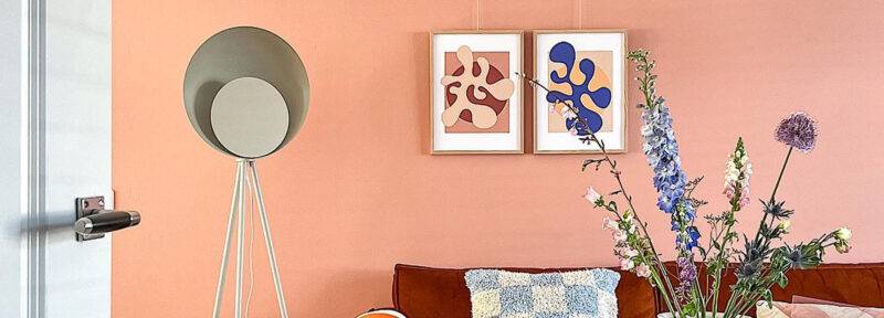 EN coloured frames on wall over sofa in living room